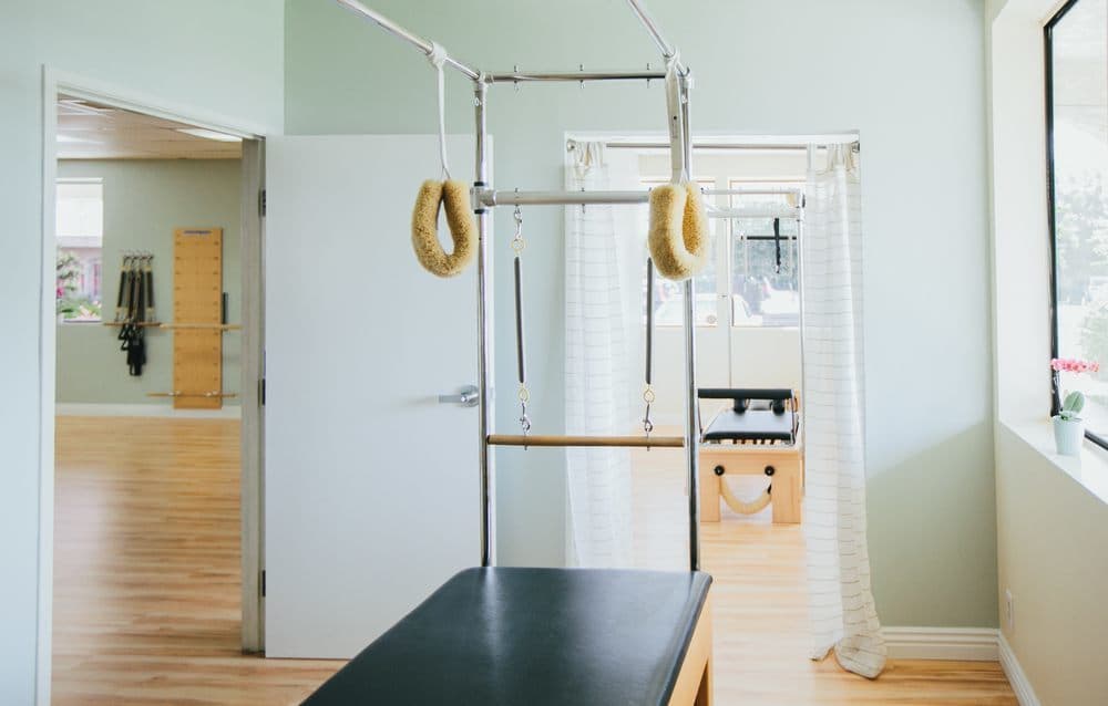 A private session on a wood reformer.